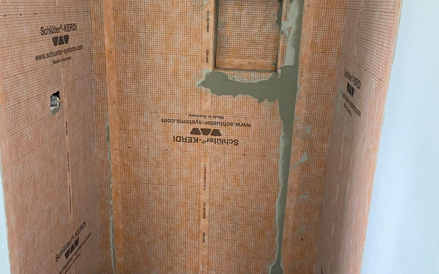 Schluter-Kerdi waterproofing membrane on shower walls before tile